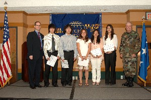 In May, chapter scholarship awardees pose with Nathan Colodney, chapter president (l) and Gen. Wood (r). The awardees were (2nd from l-2nd from r) Alexander Ahn, Chad Ahn, Hana Church, Frances Kim and Kelly Schulte.